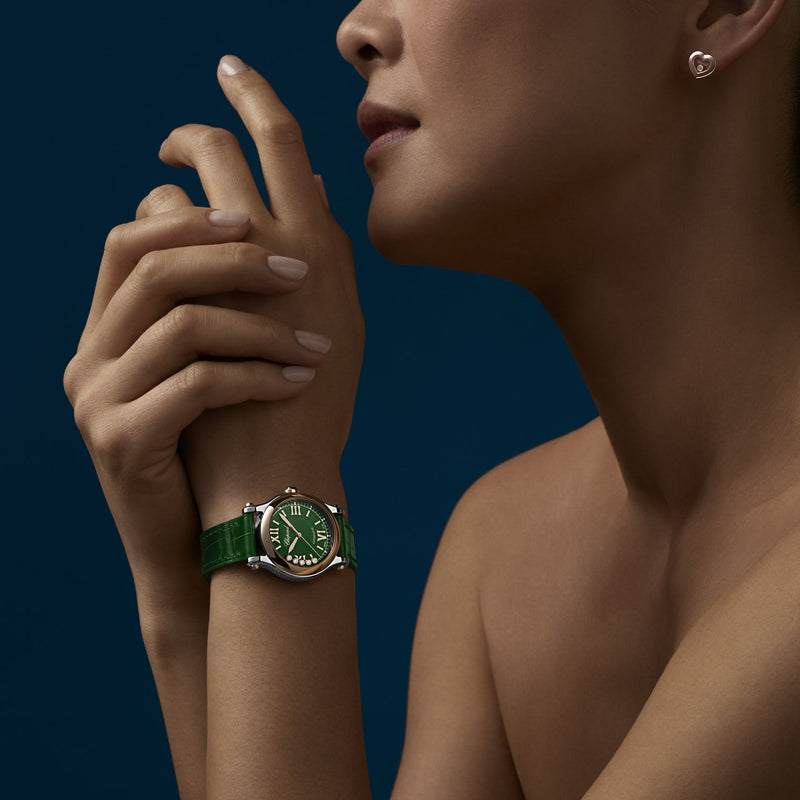 Model wearing Happy Sport Automatic Steel and Gold 30mm Green Dial Watch