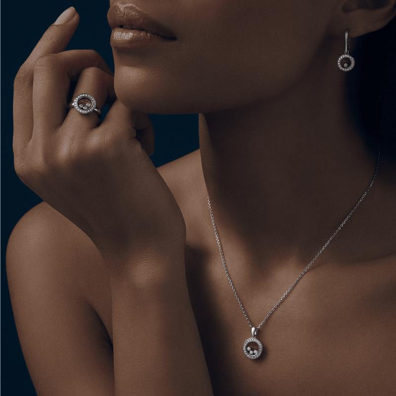 Model wearing Happy Diamonds Icons white gold pendant, ring and earring