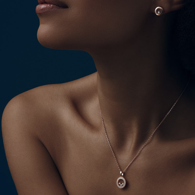 Model wearing Happy Diamonds Icons rose gold pendant and earring