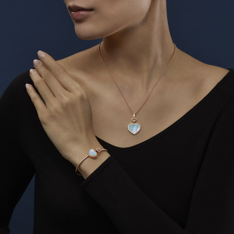 Model wearing Happy Hearts Rose Gold Turquoise Mother of Pearl Diamond Pendant and bangle