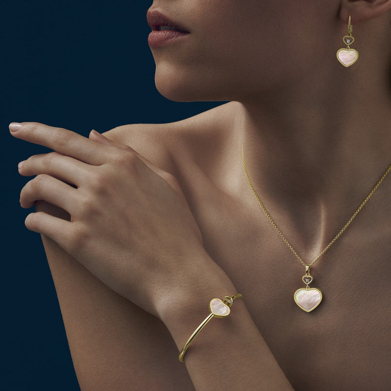 Model wearing Happy Hearts Yellow Gold Mother of Pearl Pendant